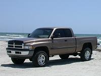 Pics of trucks with stock SLT rims and 285/305's-padre-truck.jpg